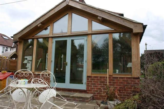 Oak gable and glazed garden elevation