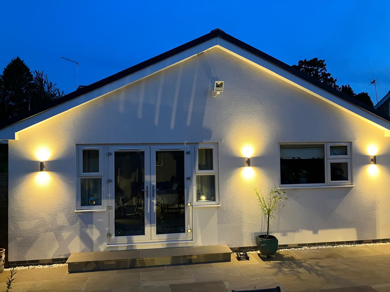 The same extension, lit at dusk