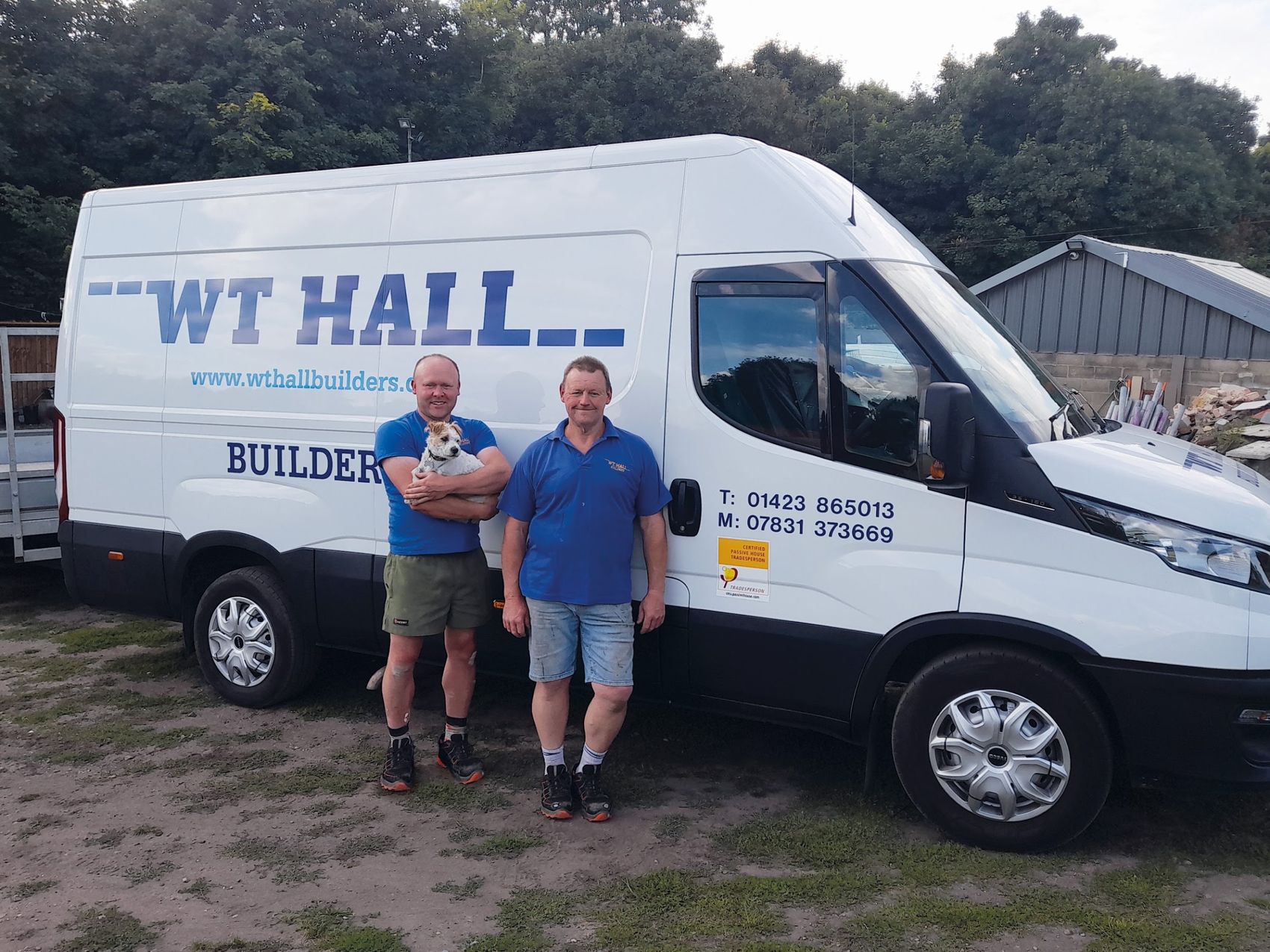 Terry and Steve Hall standing with the W T Hall Builders van